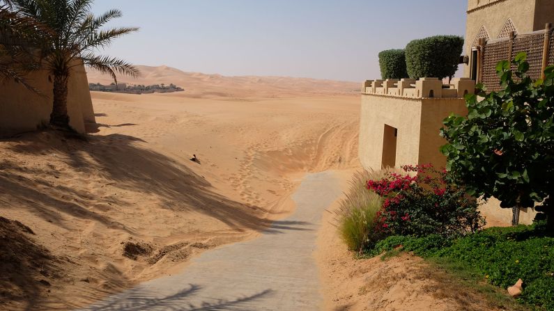 Here comes the sand: Keeping the resort from being swallowed by the desert is a constant battle. The Qasr has bulldozers on standby to clear the sand.